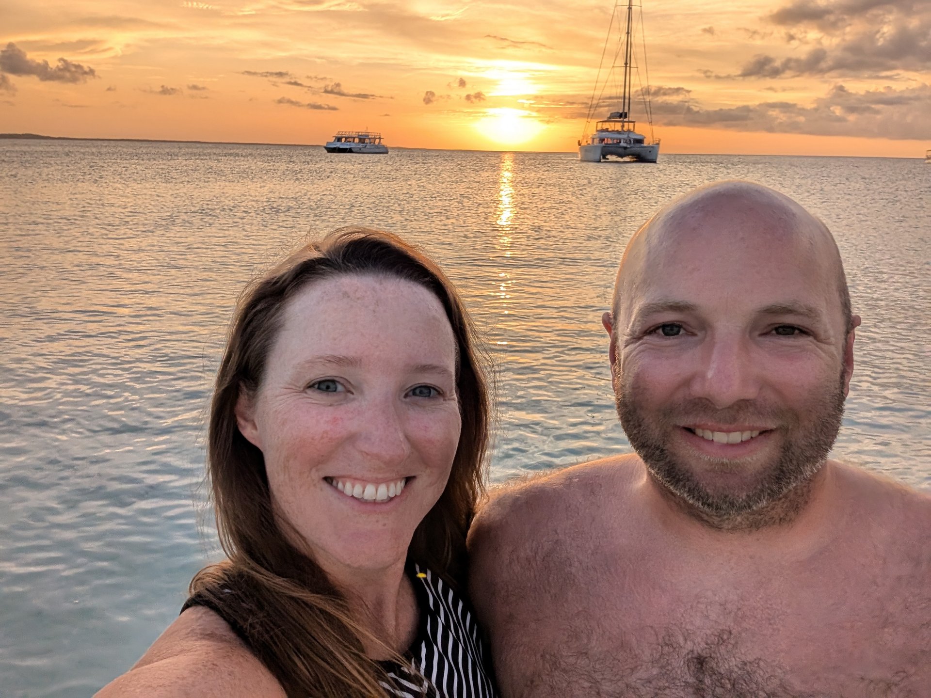 Sunset selfie with sailboats in the background
